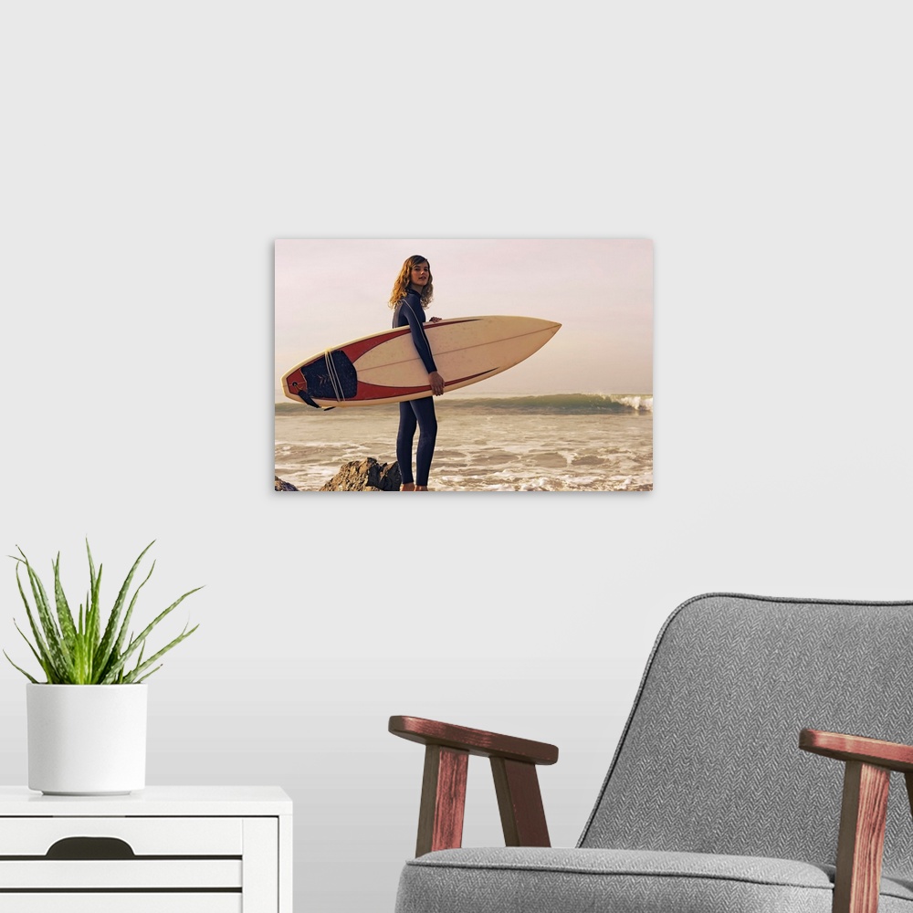 A modern room featuring Young Woman With Her Surfboard At The Beach, Tarifa, Cadiz, Andalusia, Spain