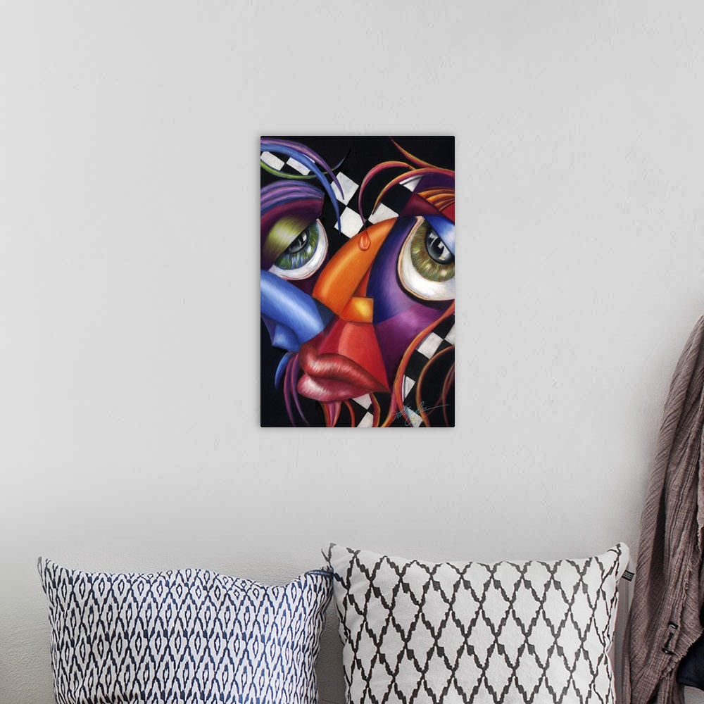 A bohemian room featuring Contemporary artwork in the style of cubism of a face in bold colors.