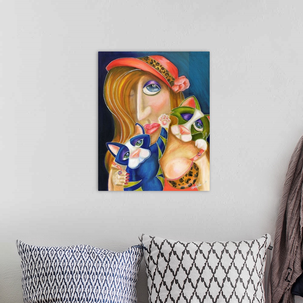 A bohemian room featuring Contemporary artwork in the style of cubism of a woman with two cats in bold colors.