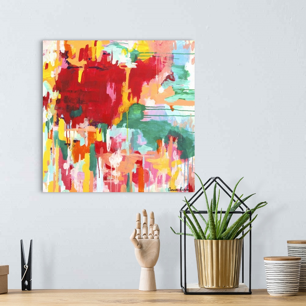 A bohemian room featuring Contemporary abstract artwork in red, yellow, and green tones.