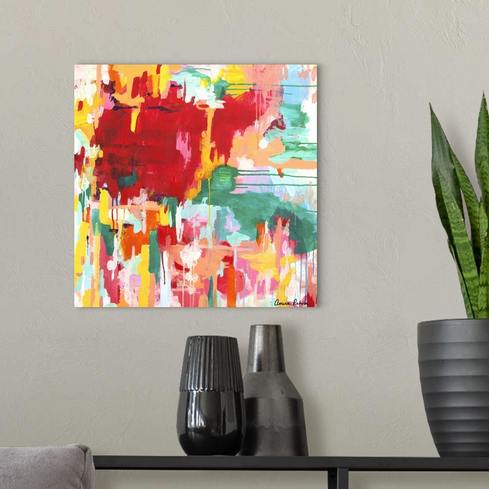 A modern room featuring Contemporary abstract artwork in red, yellow, and green tones.