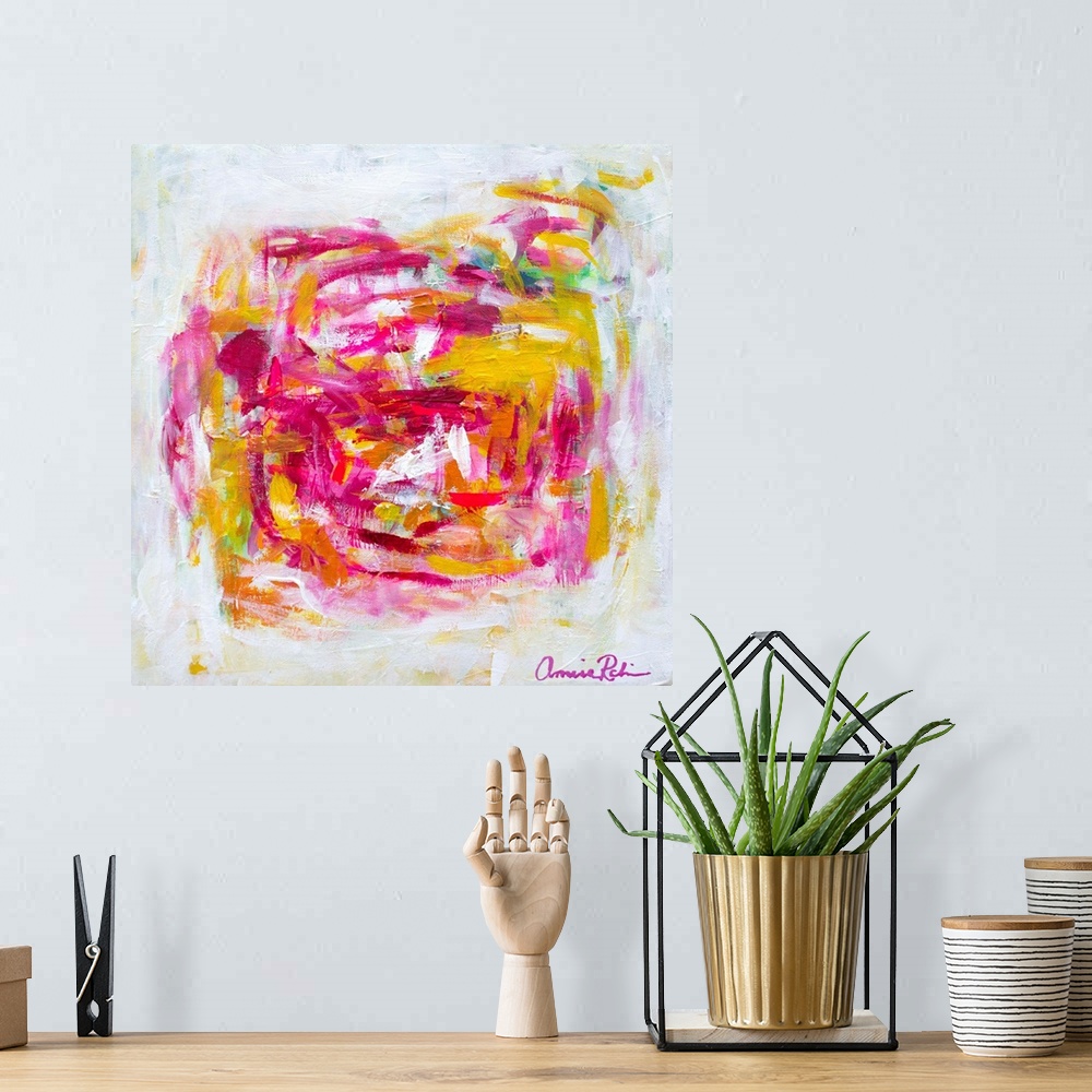 A bohemian room featuring Abstract contemporary artwork in cheerful pinks and yellows.