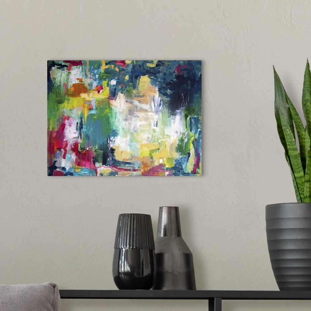 A modern room featuring Contemporary abstract artwork in strong red, yellow, and blue tones.