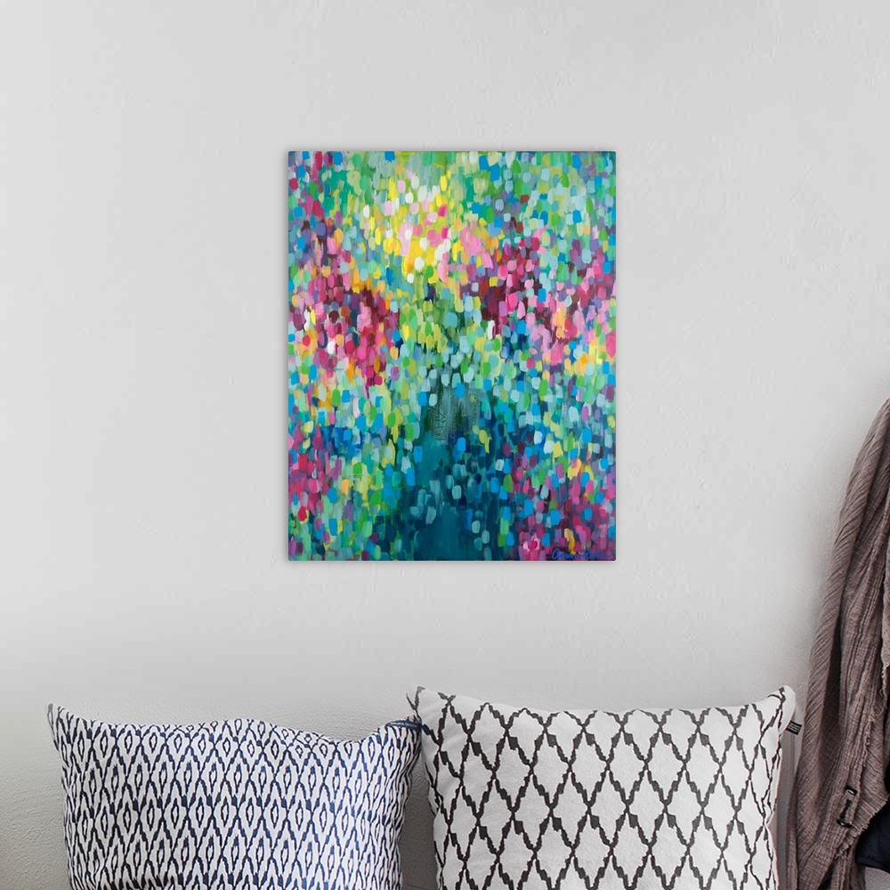 A bohemian room featuring Contemporary abstract painting of vivid multicolored spots, resembling confetti.