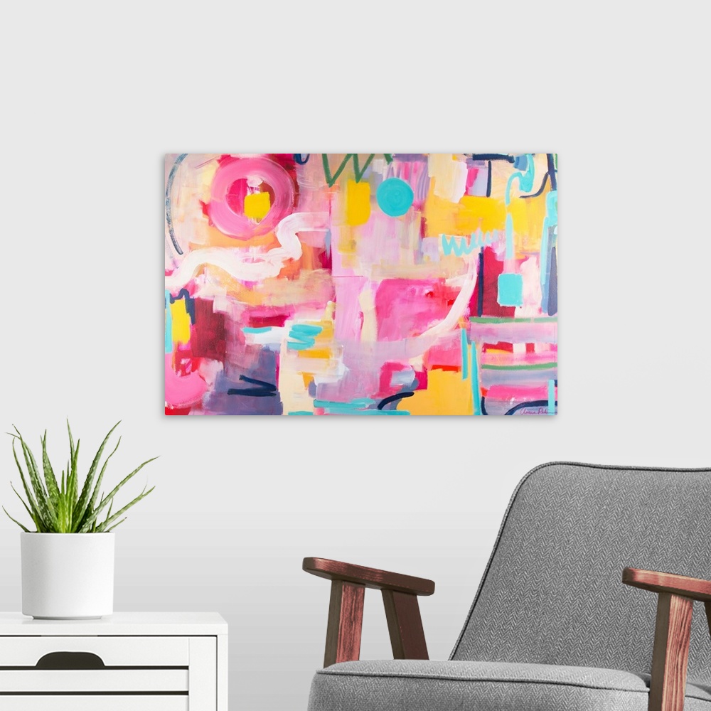 A modern room featuring Contemporary artwork in pink, yellow, and turquoise.