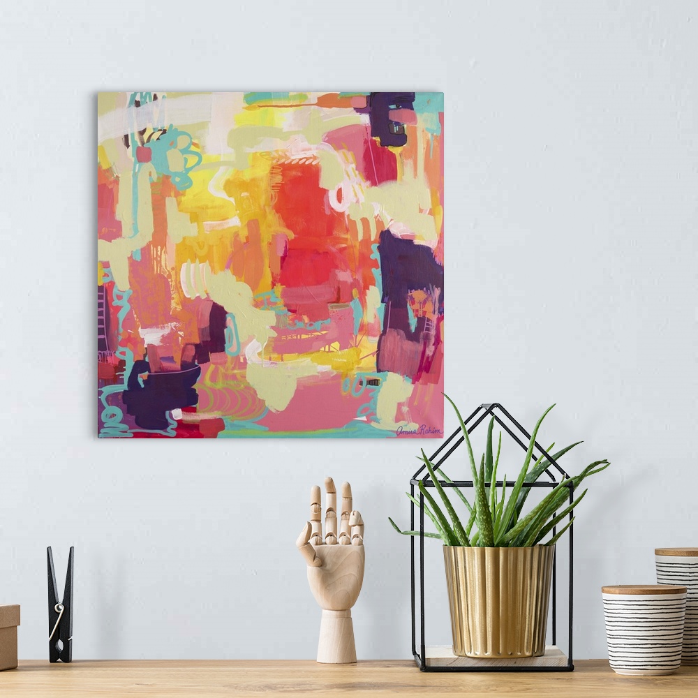 A bohemian room featuring Mixed media abstract painting in tropical red, yellow, and teal tones.