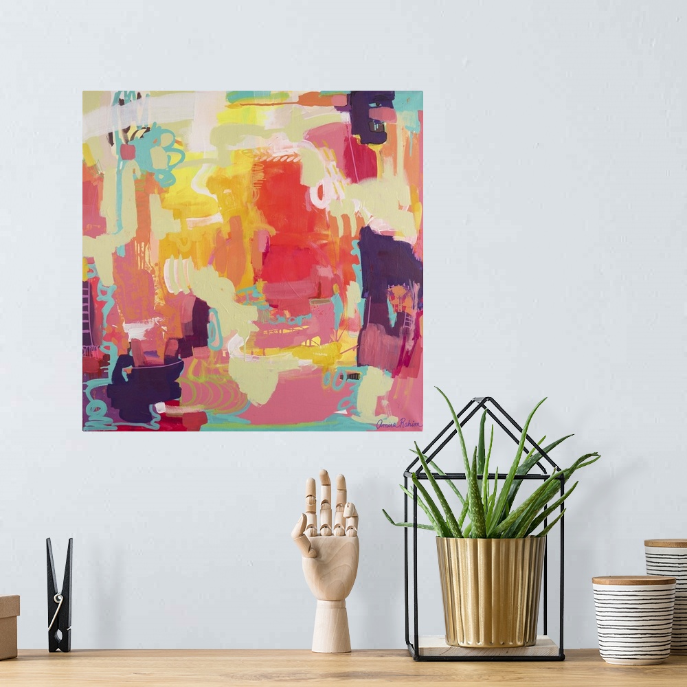 A bohemian room featuring Mixed media abstract painting in tropical red, yellow, and teal tones.