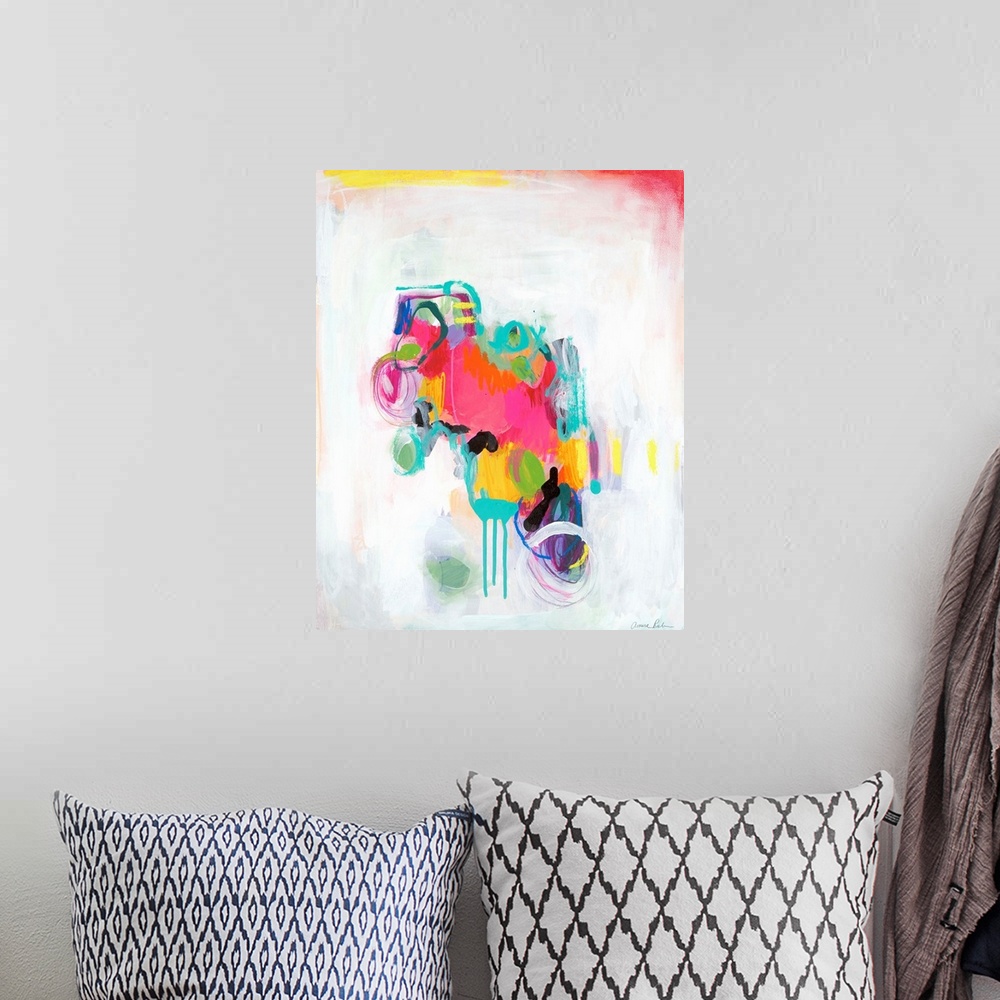 A bohemian room featuring Abstract mixed media artwork with vivid pink, teal, and yellow color on white.