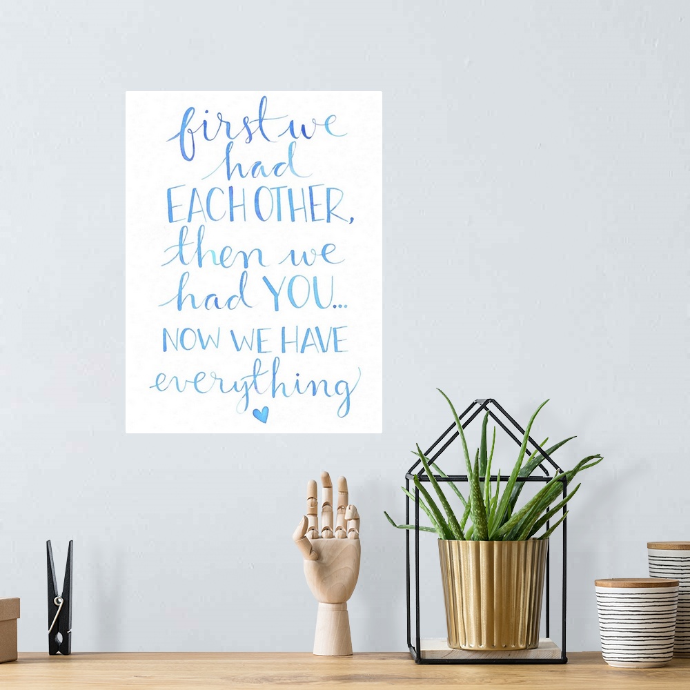 A bohemian room featuring The words "First we had each other, then we had you... now we have everything." hand written in l...