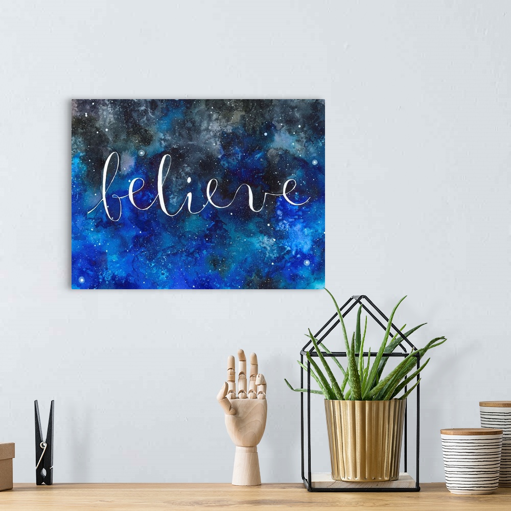 A bohemian room featuring The word "Believe" handwritten on a starry night sky.