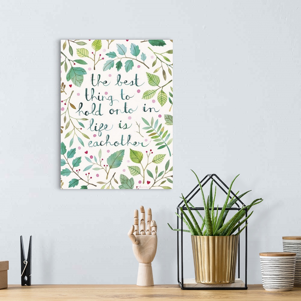 A bohemian room featuring Contemporary painting of hand-lettered text surrounded by delicate leaves.