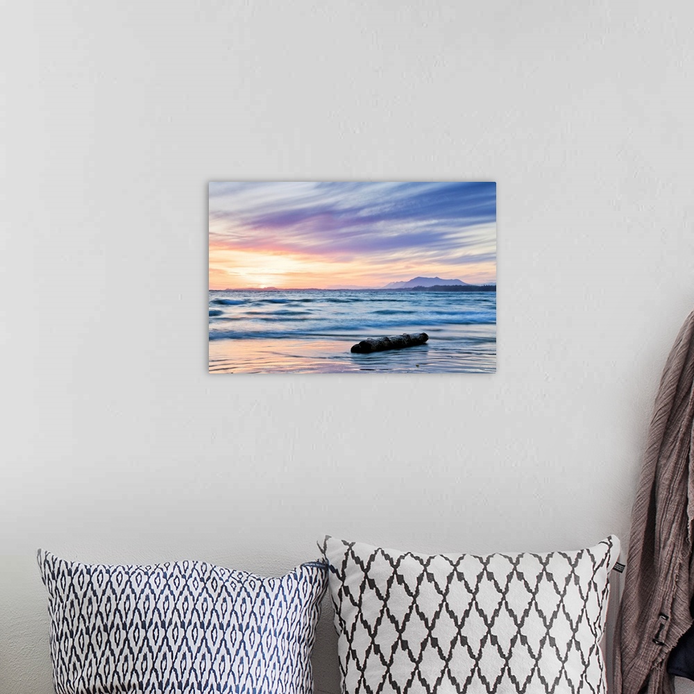 A bohemian room featuring A seascape of the ocean at sunrise in British Columbia, Ontario.