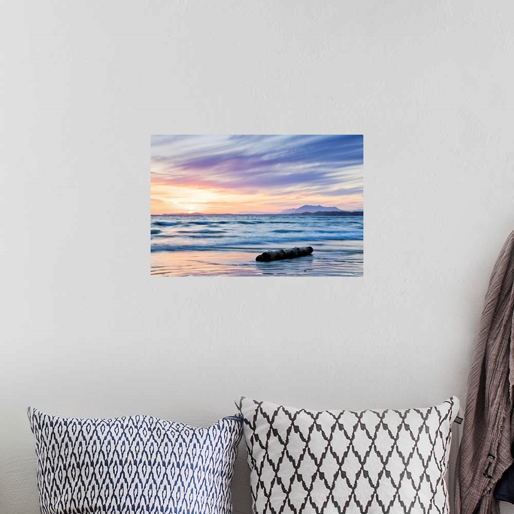 A bohemian room featuring A seascape of the ocean at sunrise in British Columbia, Ontario.