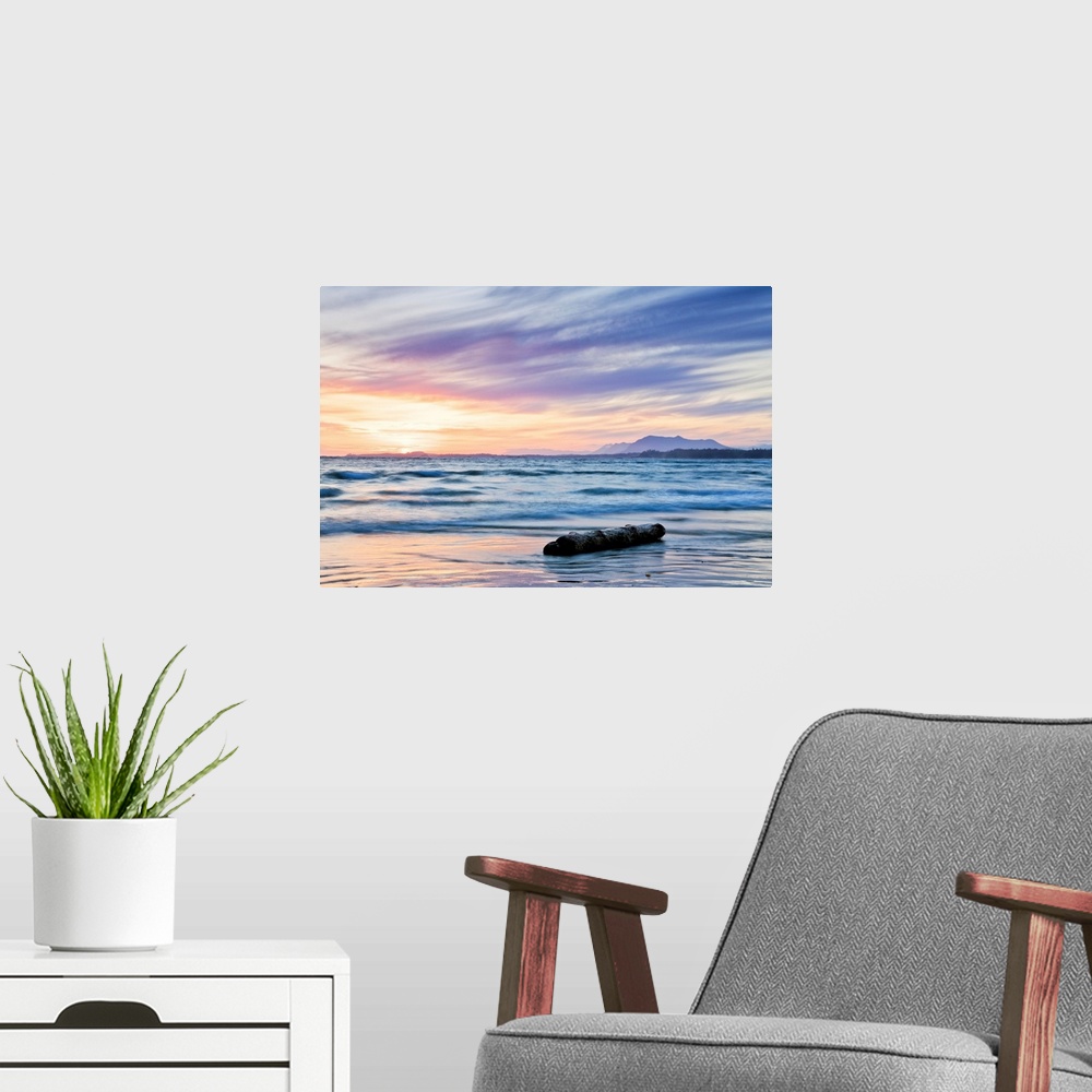A modern room featuring A seascape of the ocean at sunrise in British Columbia, Ontario.