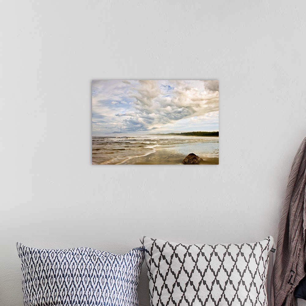 A bohemian room featuring Oversized, horizontal, fine art photograph of the shoreline on a beach, beneath a sky of fluffy c...