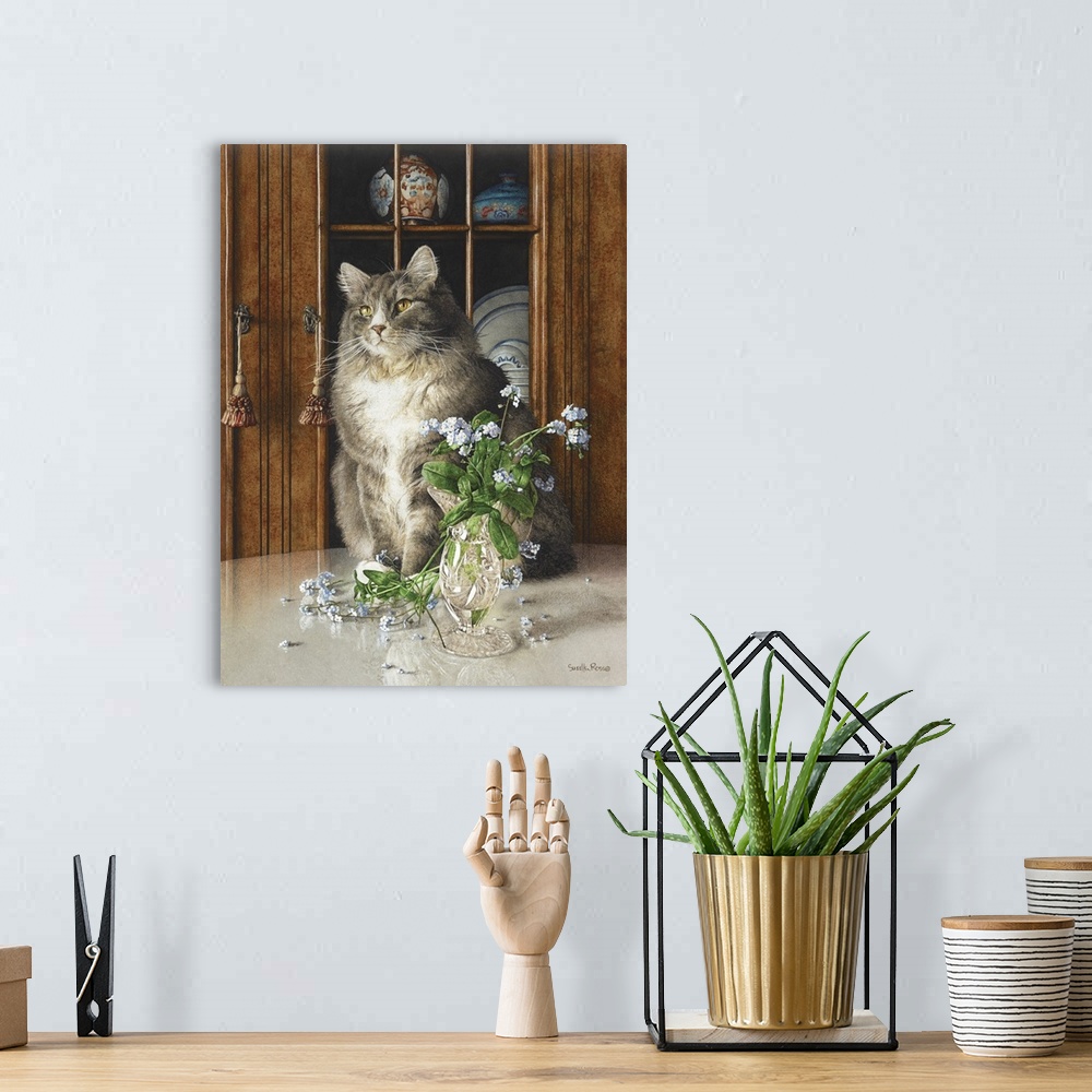 A bohemian room featuring Vertical image of a white and gray cat sitting on a table next to a glass vase of blue flowers.