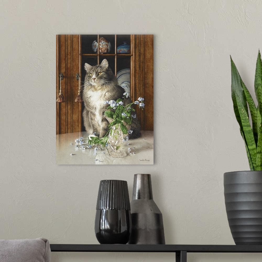A modern room featuring Vertical image of a white and gray cat sitting on a table next to a glass vase of blue flowers.