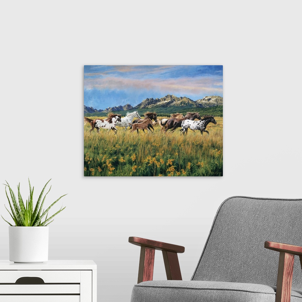 A modern room featuring Painting of wild horses running through a meadow of flowers and tall grass with mountains in the ...