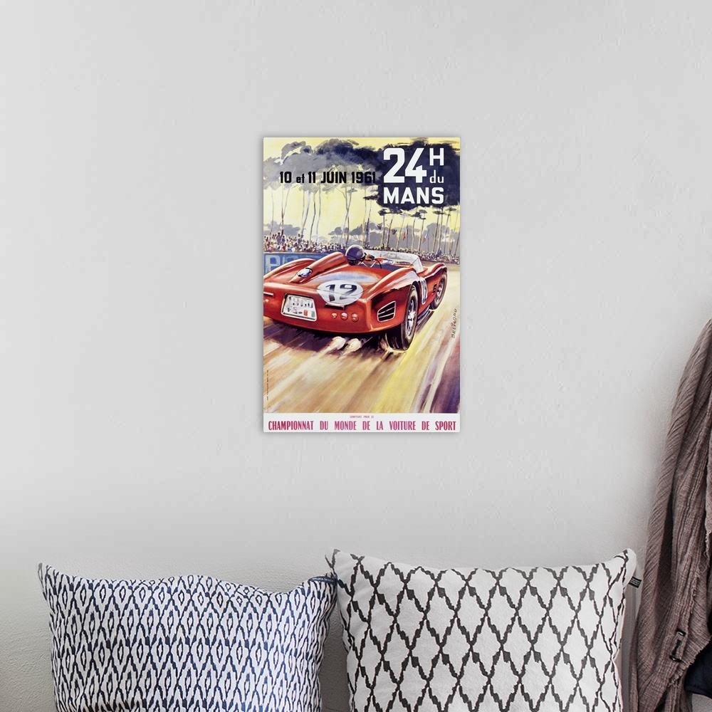 A bohemian room featuring Giant antique advertising art for a car racing world championship showcases an automobile driving...