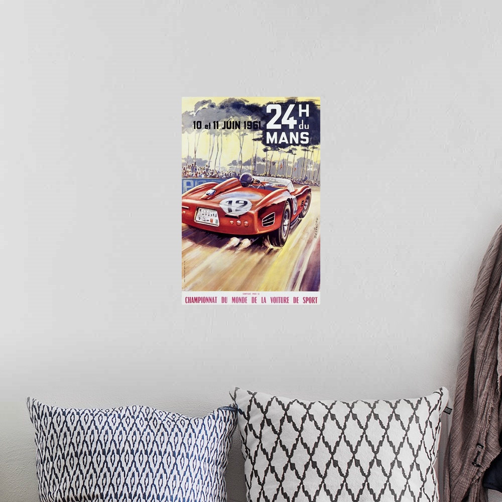 A bohemian room featuring Giant antique advertising art for a car racing world championship showcases an automobile driving...