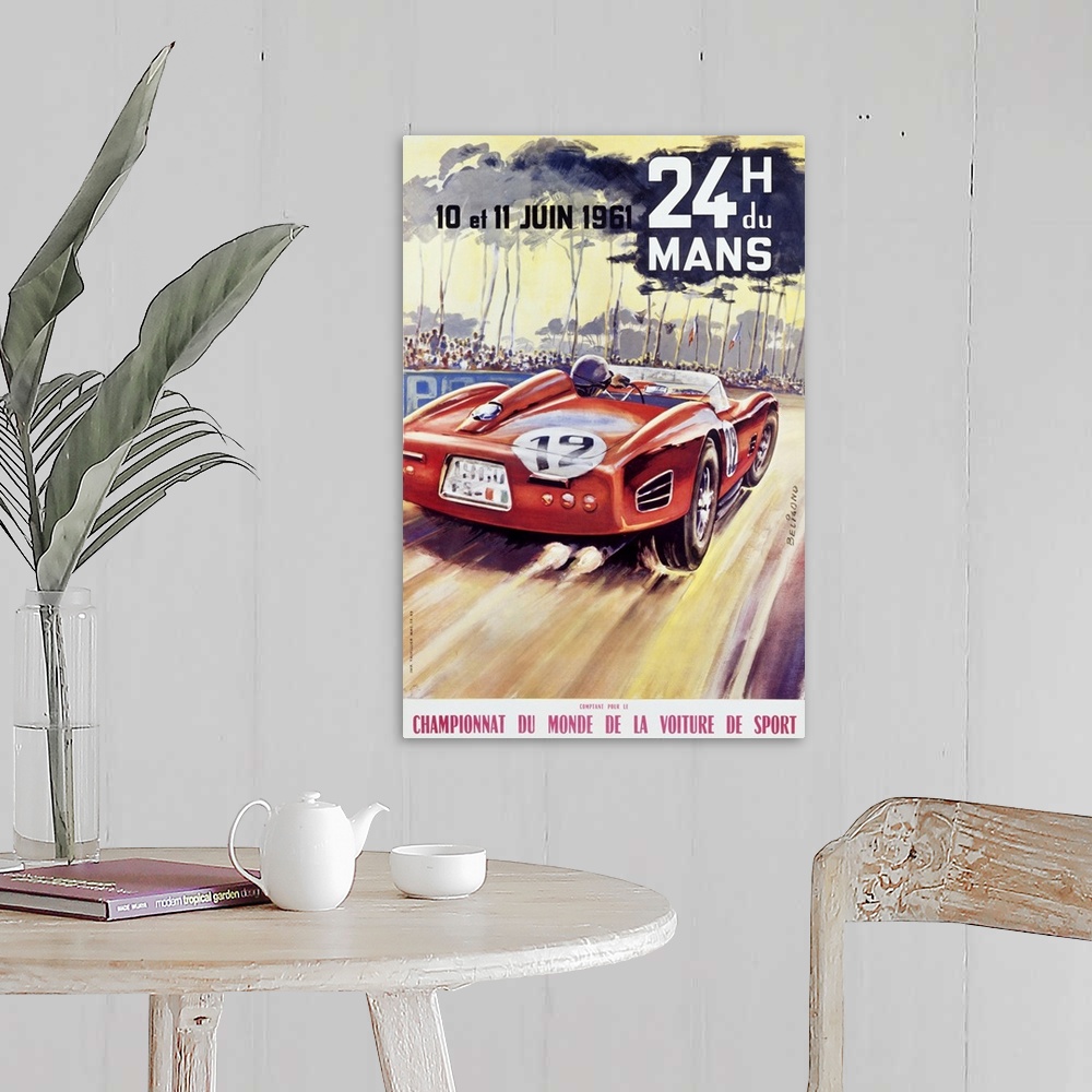 A farmhouse room featuring Giant antique advertising art for a car racing world championship showcases an automobile driving...