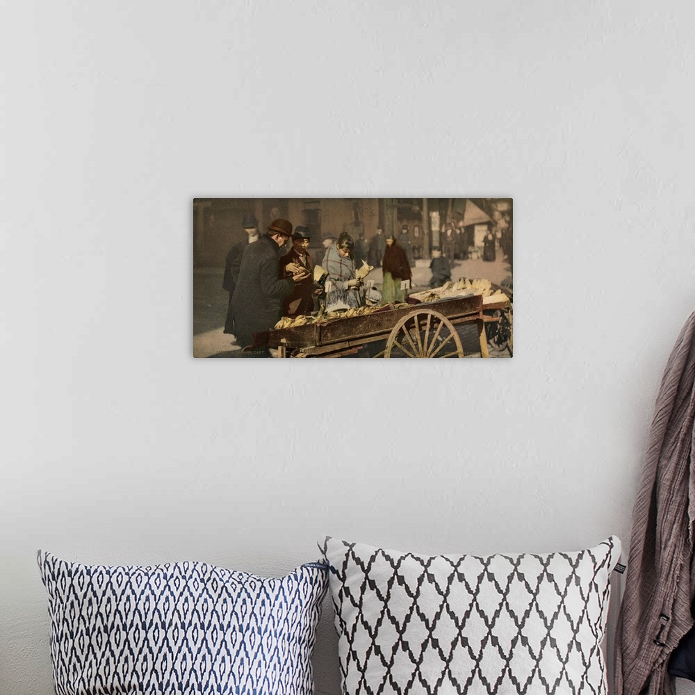 A bohemian room featuring Hand colored photograph of a banana cart.