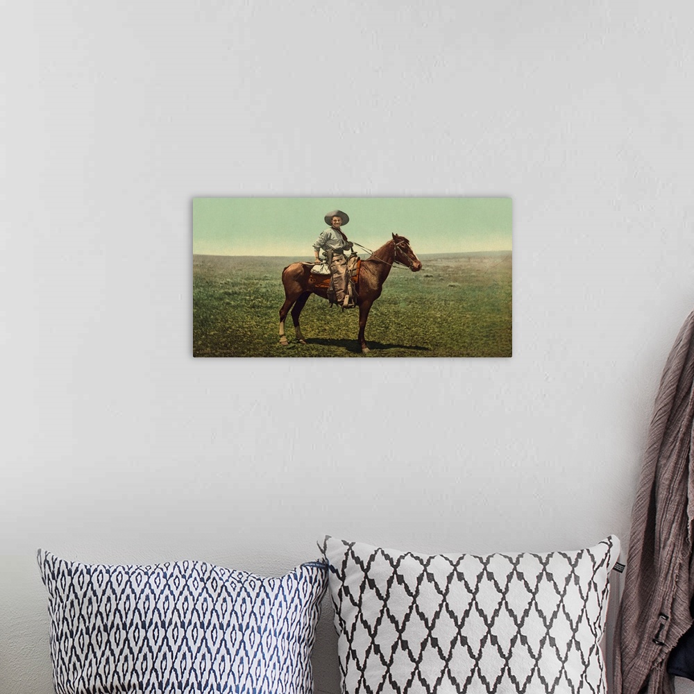A bohemian room featuring Hand colored photograph of a cowboy.