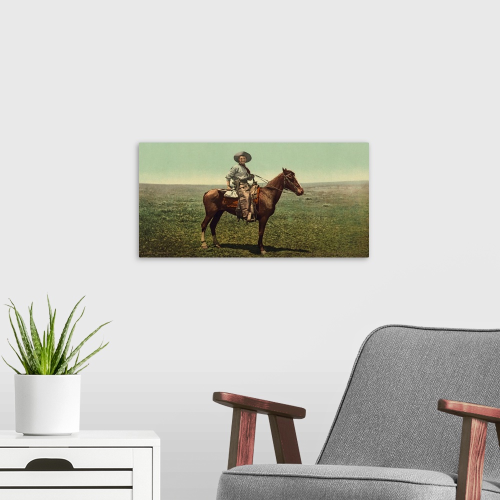A modern room featuring Hand colored photograph of a cowboy.