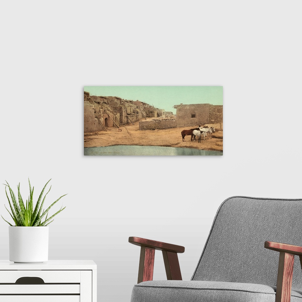 A modern room featuring Hand colored photograph of Acoma, New Mexico.