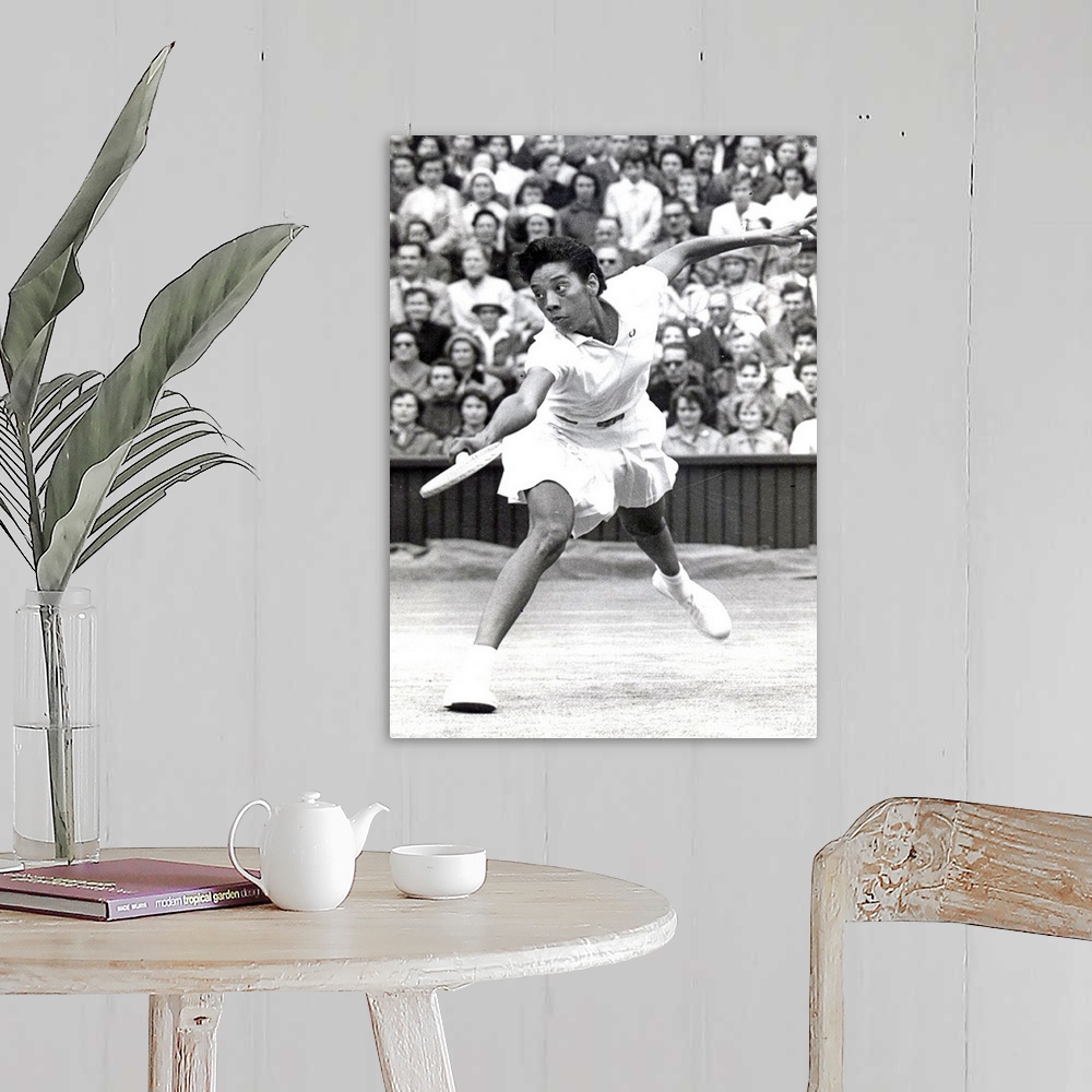 A farmhouse room featuring UNDATED:  Althea Gibson of the United States plays during Wimbledon in 1956  Gibson, the first bl...