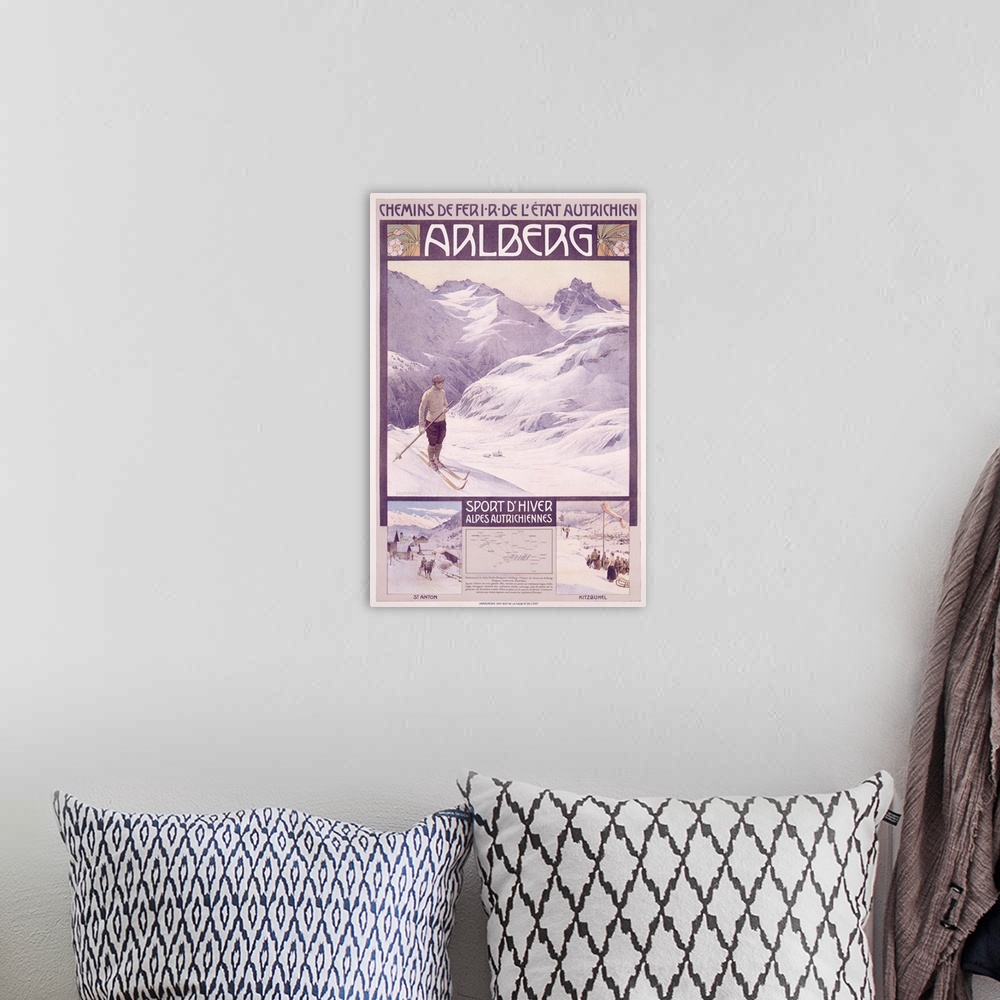 A bohemian room featuring A vintage poster of a single skier standing on a hill looking out onto the snow covered mountains.