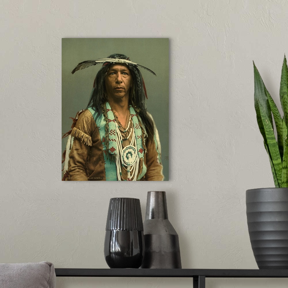 A modern room featuring Hand colored photograph of arrow maker, on Ojibwa brave.