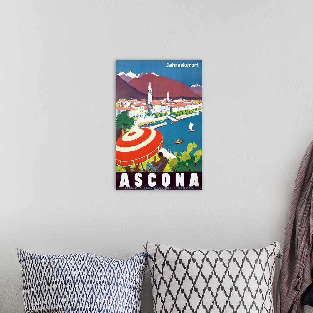 A bohemian room featuring Vintage poster of a woman sitting under an umbrella on a hill that overlooks a body of water with...