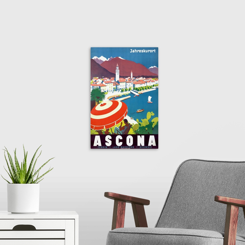 A modern room featuring Vintage poster of a woman sitting under an umbrella on a hill that overlooks a body of water with...