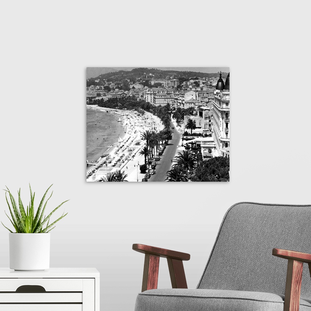 A modern room featuring Elevated view, including beachfront, Cannes, France, 1940s