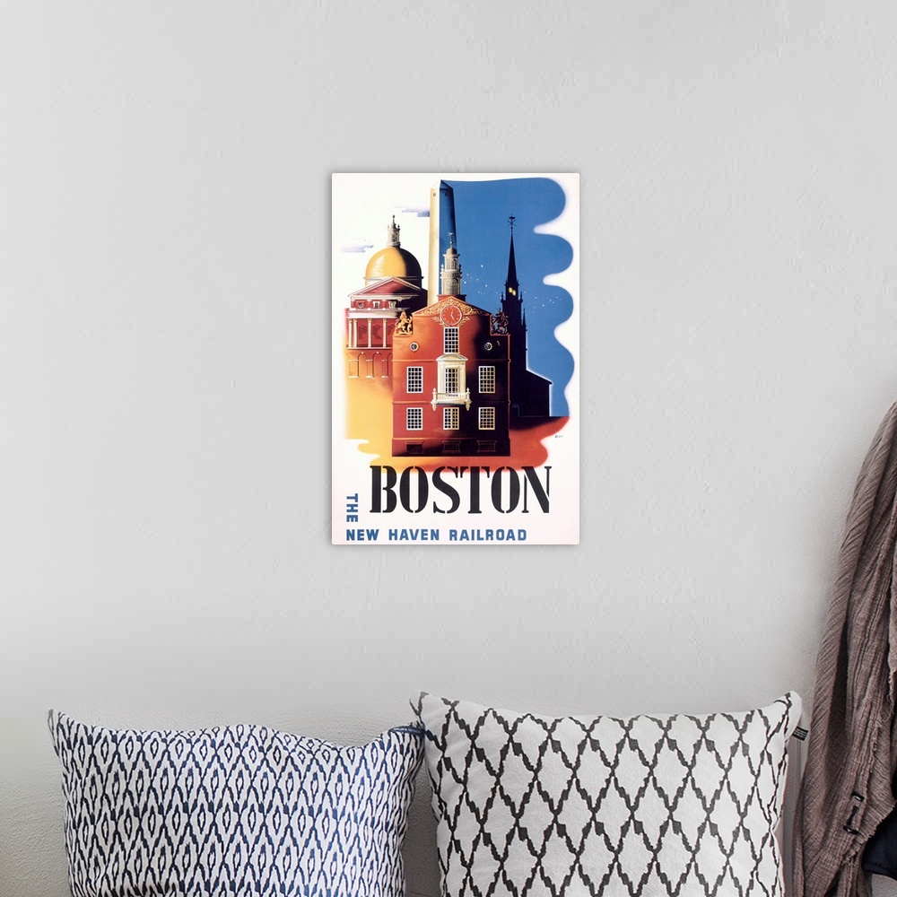 A bohemian room featuring Old poster print advertising U.S city.  There are buildings on the poster with the name of the ci...