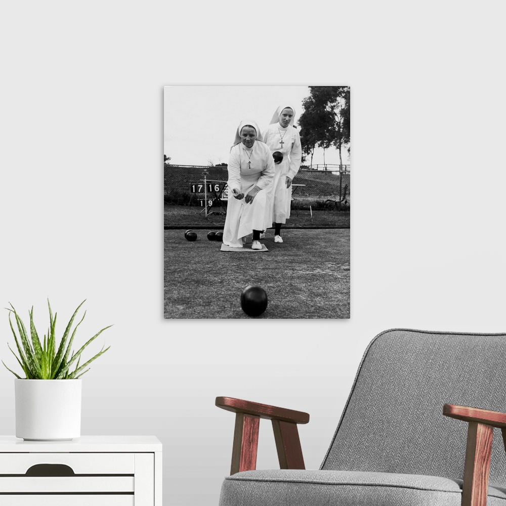 A modern room featuring Nuns Sister Edward and Sister Andrea playing bowls during a break from ward duty at Mount St Marg...