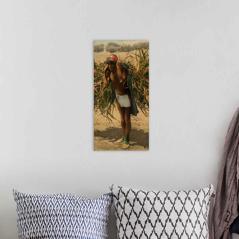 A bohemian room featuring Hand colored photograph of bringing in the harvest.