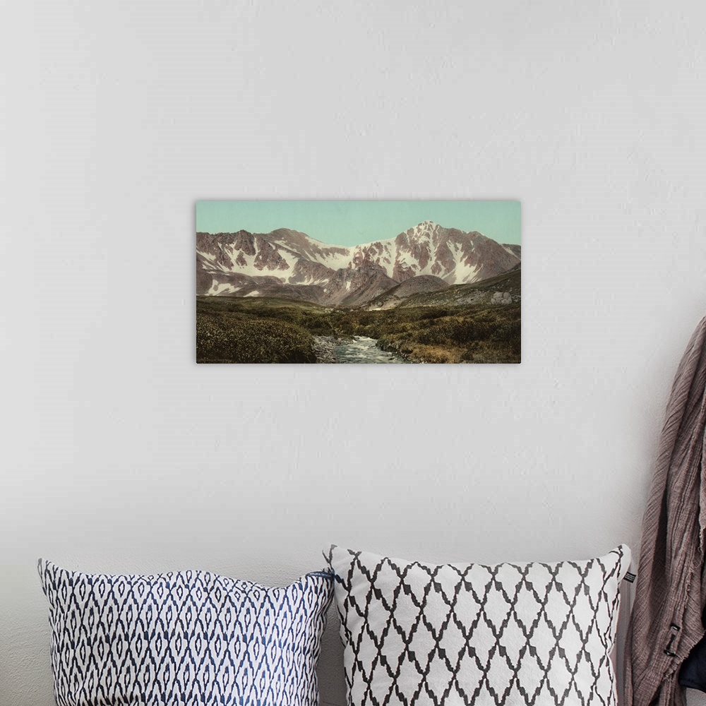 A bohemian room featuring Hand colored photograph of Colorado. Gray's and Torreyos peaks.