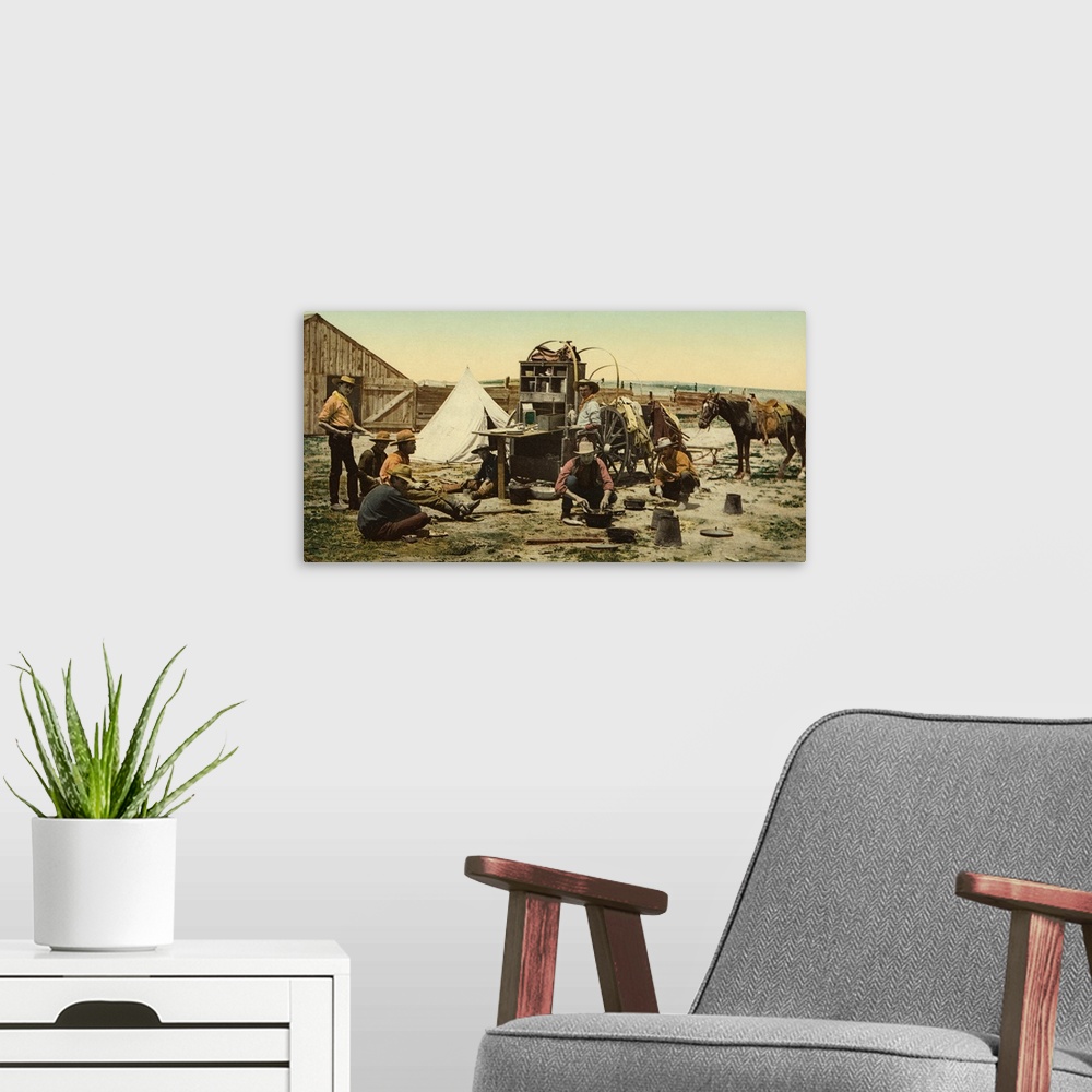 A modern room featuring Hand colored photograph of Colorado. The round up, "grub pile".
