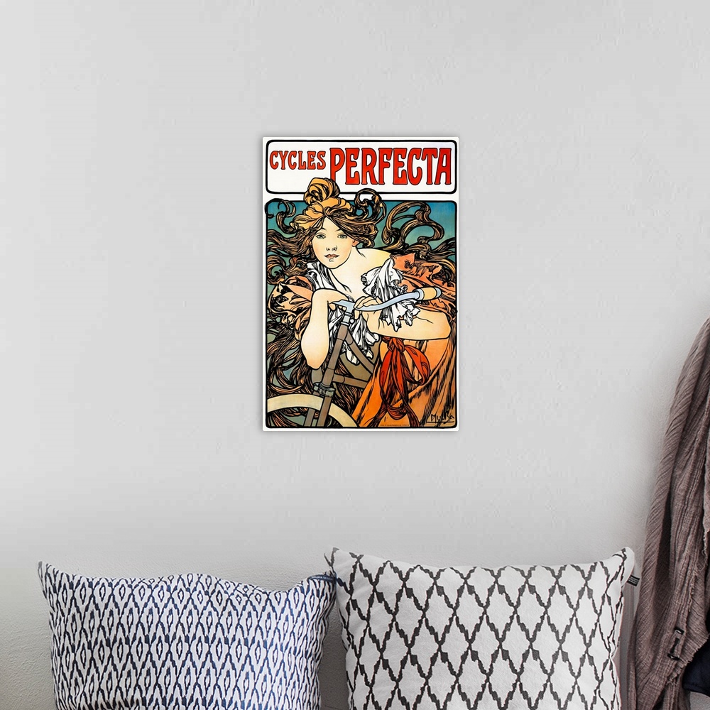A bohemian room featuring Art Nouveau poster of a beautiful female figure draped over a bicycle with flowing hair.