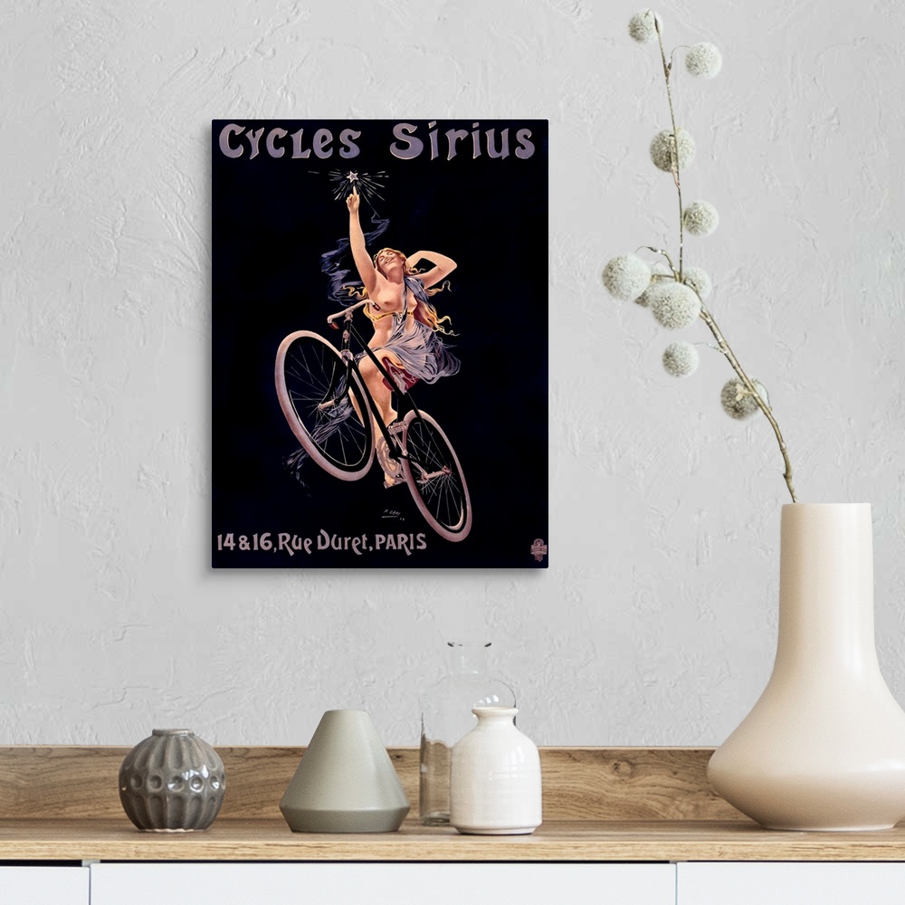 A farmhouse room featuring Vintage poster of a woman on a bicycle reaching up to touch a star with text written above and be...