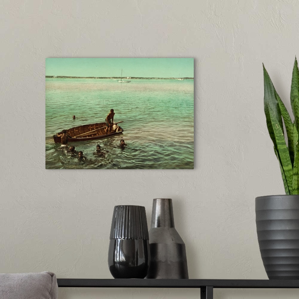 A modern room featuring Hand colored photograph of diving for coins, Nassau, Bahama islands.