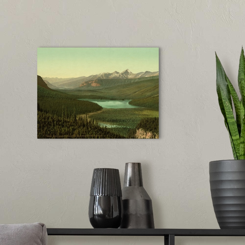 A modern room featuring Hand colored photograph of emerald lake and van horn i.e., Horne range, British Columbia.