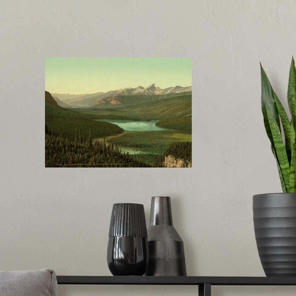 A modern room featuring Hand colored photograph of emerald lake and van horn i.e., Horne range, British Columbia.