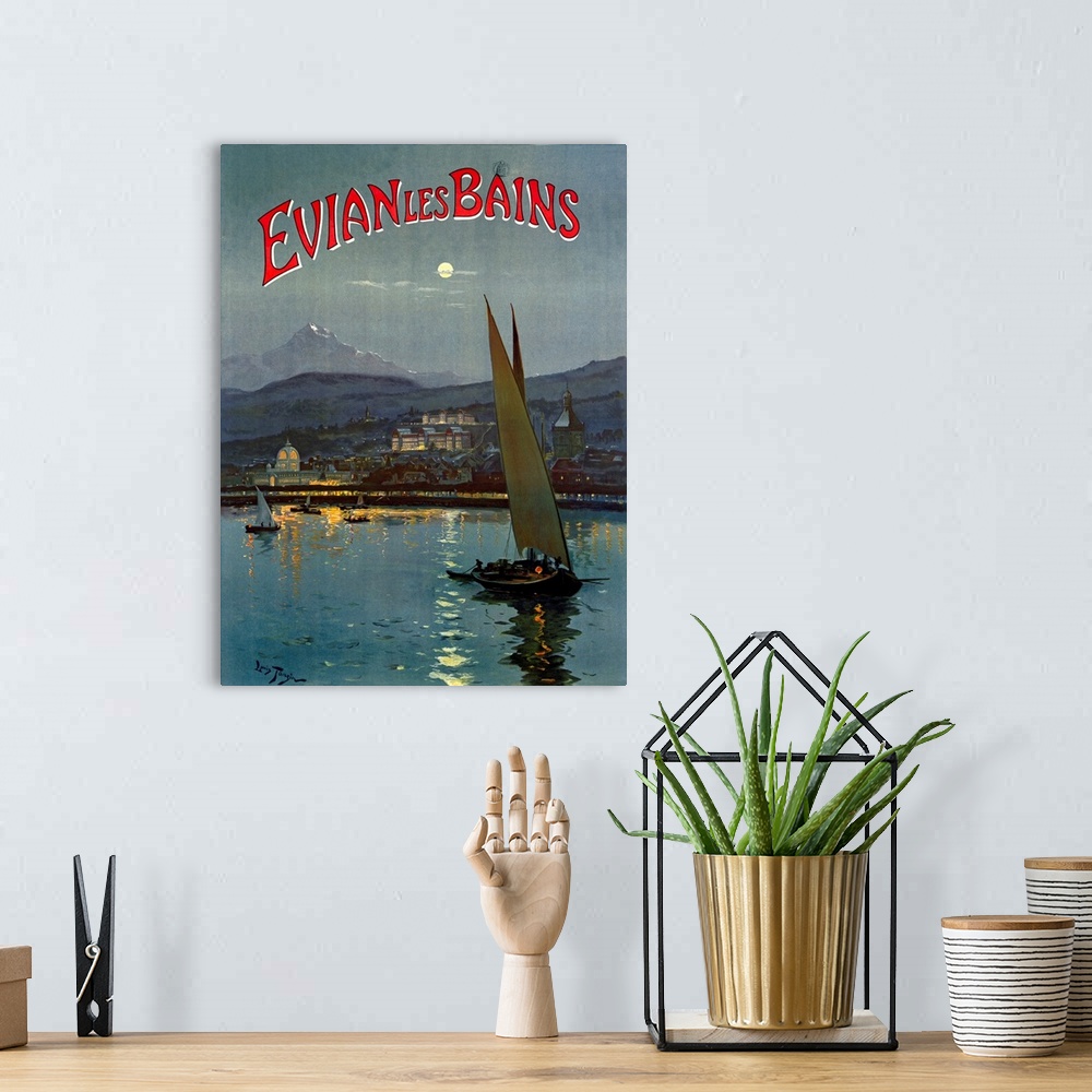 A bohemian room featuring Big, vertical vintage travel advertisement for Evian les Bains of several sailboats in the moonli...