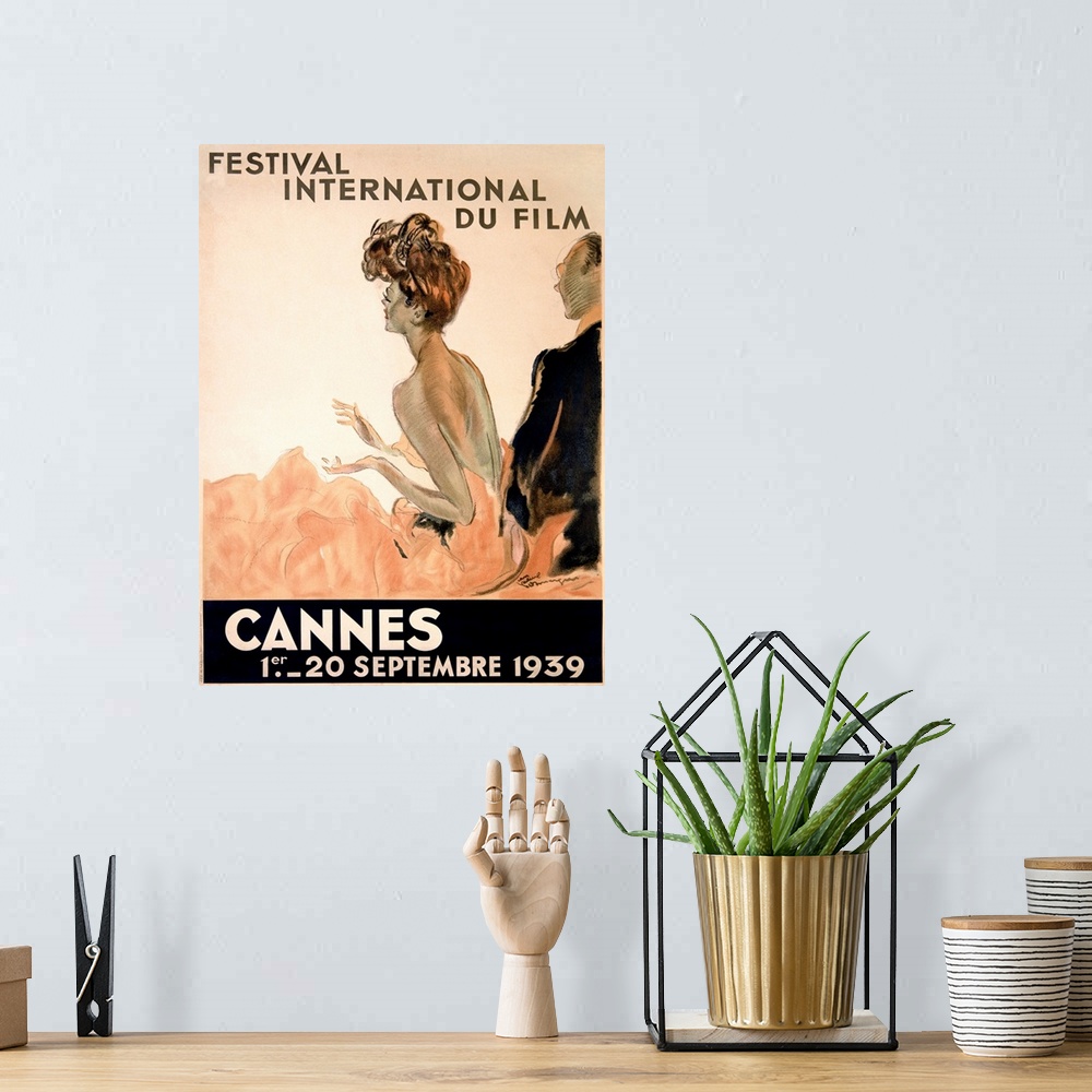 A bohemian room featuring Vintage advertising poster from 1939 showing a woman in a gown and a man in a tuxedo watching a f...