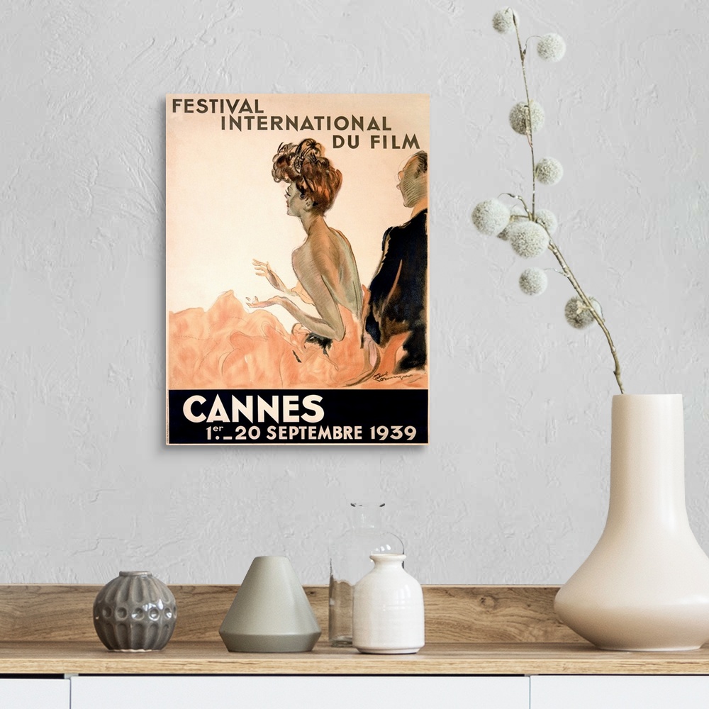 A farmhouse room featuring Vintage advertising poster from 1939 showing a woman in a gown and a man in a tuxedo watching a f...