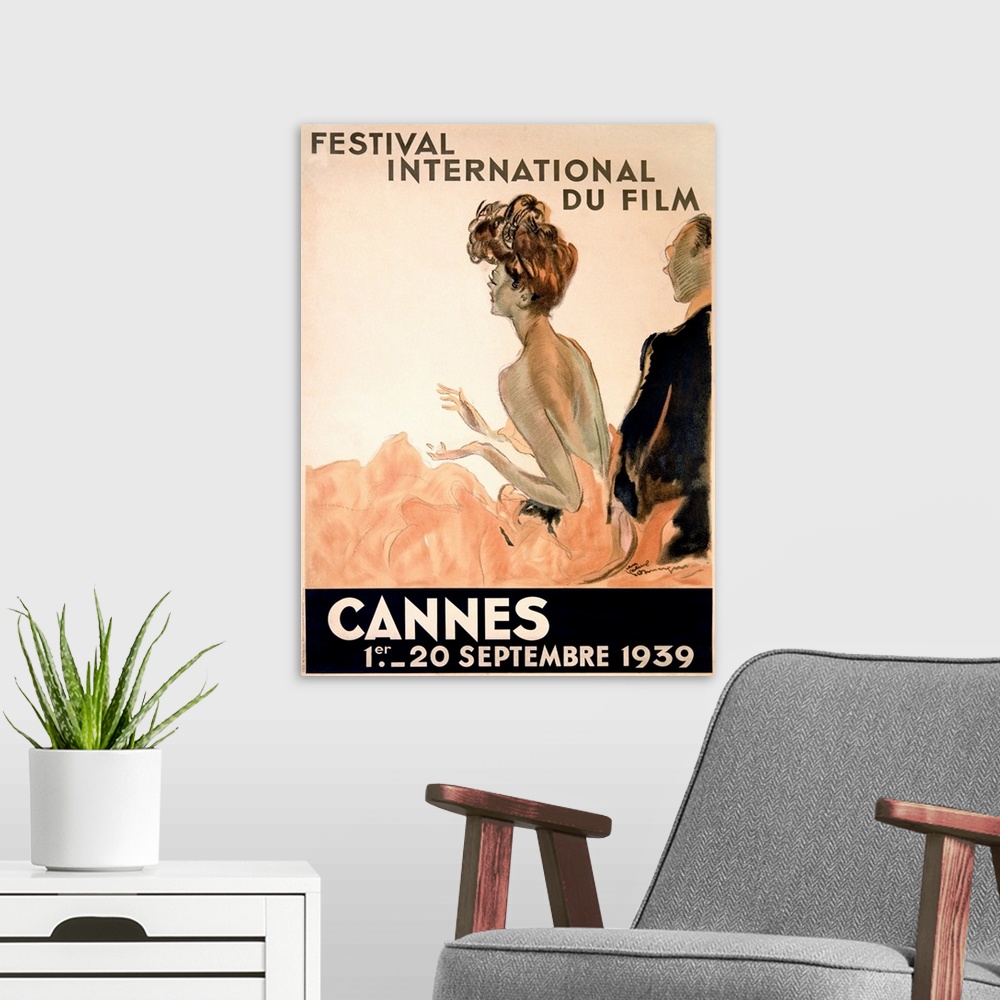 A modern room featuring Vintage advertising poster from 1939 showing a woman in a gown and a man in a tuxedo watching a f...