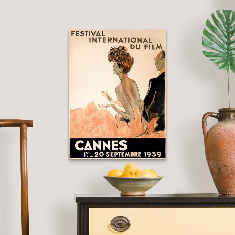 A traditional room featuring Vintage advertising poster from 1939 showing a woman in a gown and a man in a tuxedo watching a f...